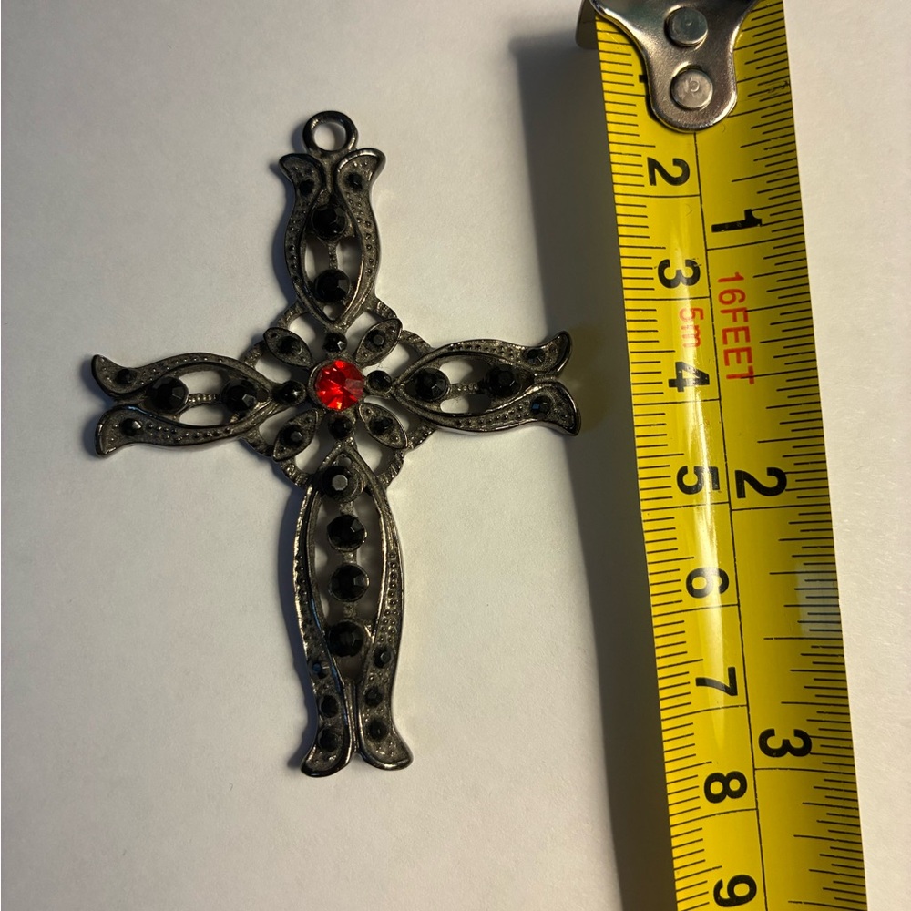 Ornate Cross Pendant with Red and Black Accents
